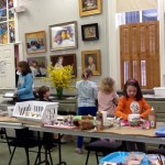 GAC children's class students with their self-portraits